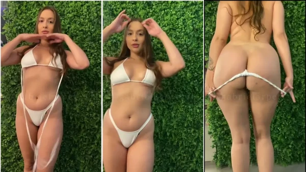 A jovem Gabriela Petry se despindo do biquíni